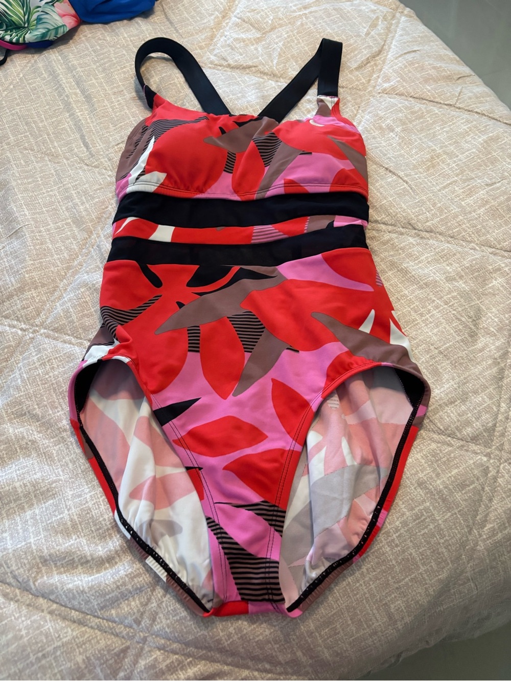 NWOT Nike woman’s one piece swimsuit with black mesh horizontal panels Med